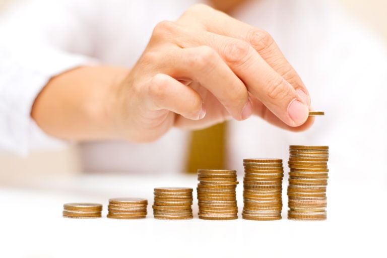 Man stacking coins