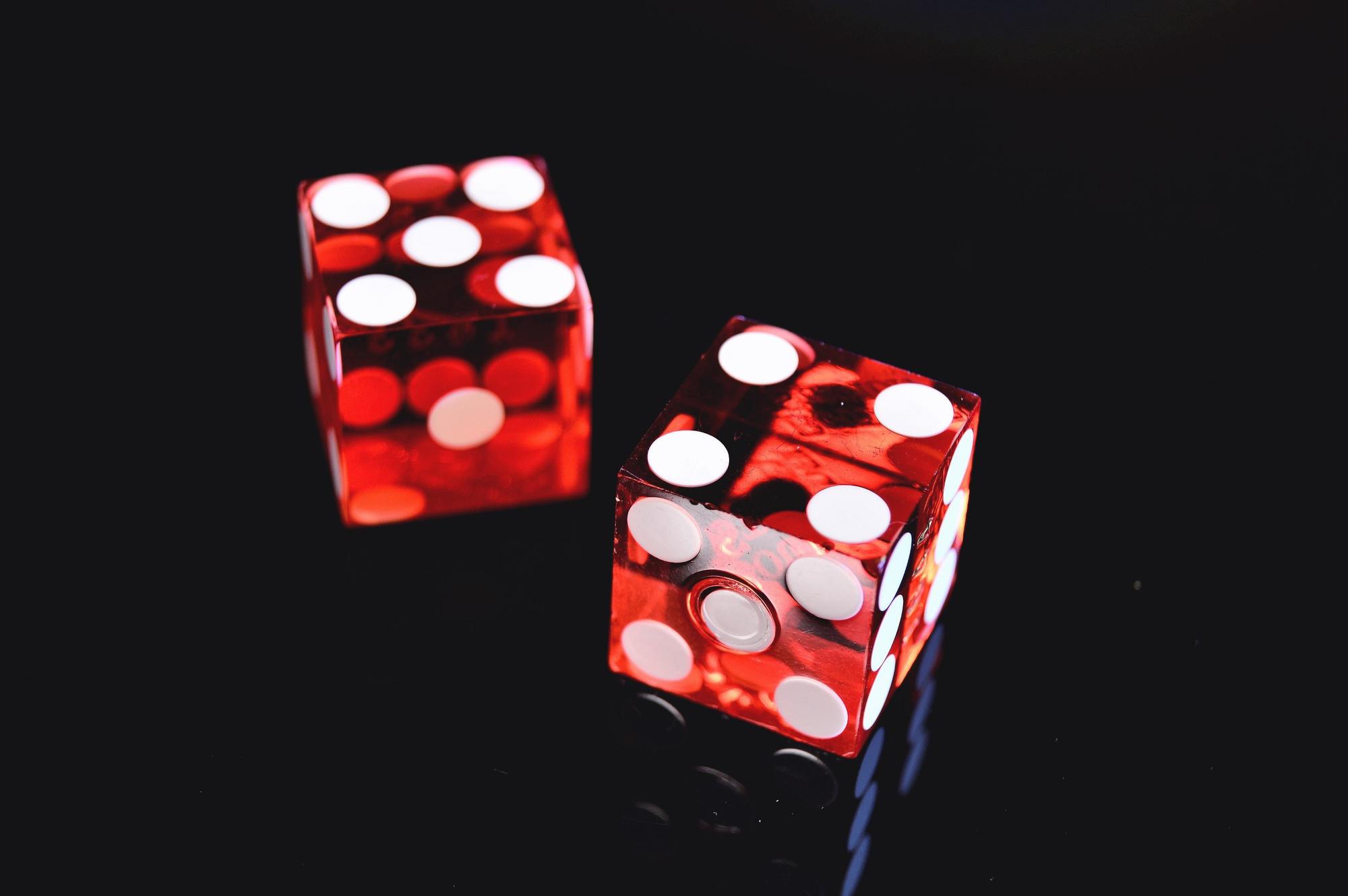 red dice on a black background