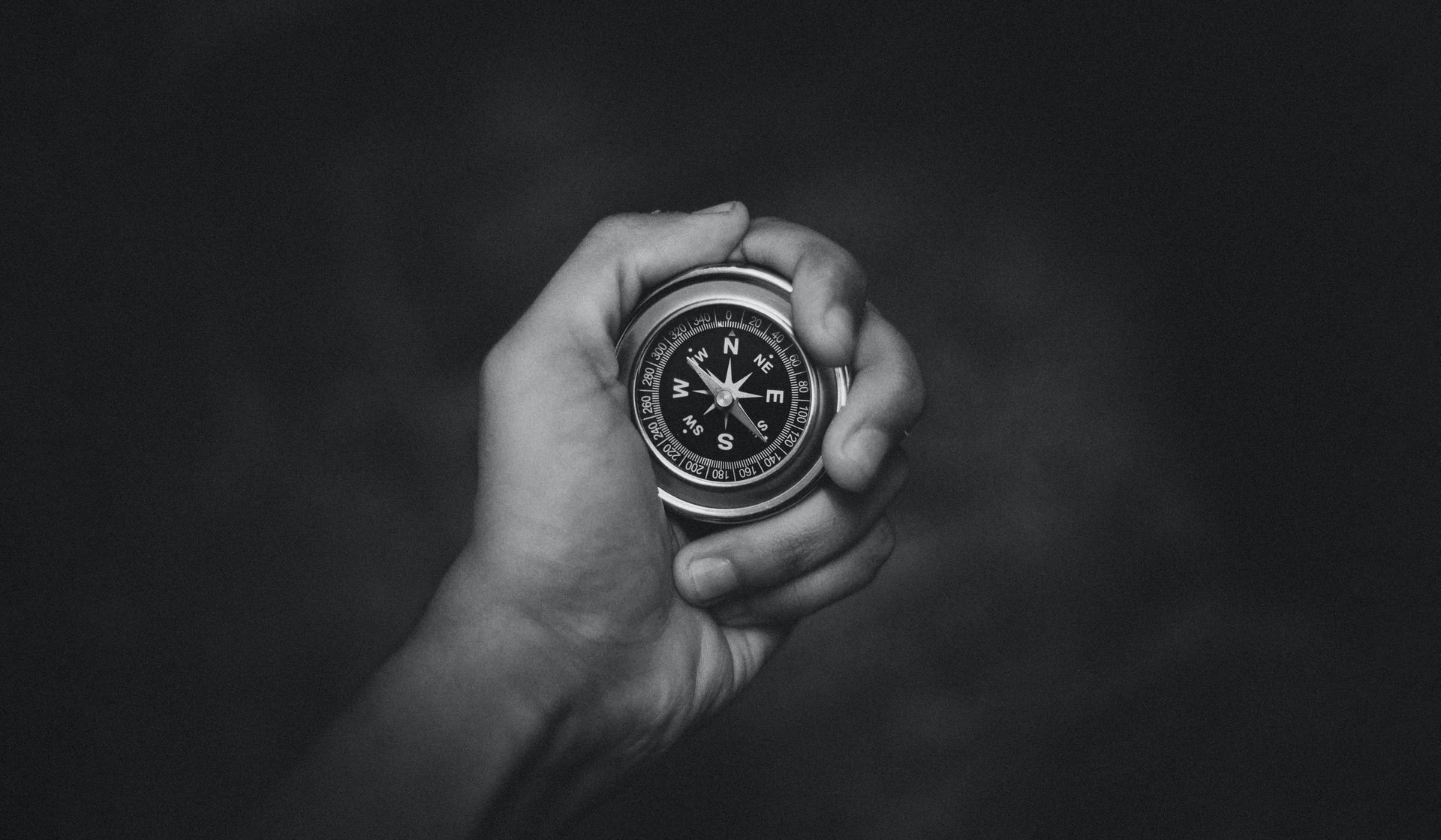 person holding a compass