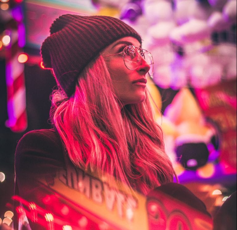 women surrounded by casino lights