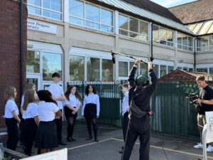 school children filming in the playground